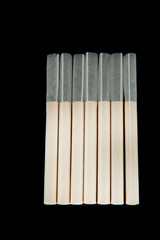 Empty cigarette tubes, isolated on black