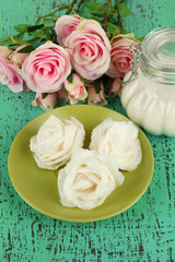 Sugar roses and natural roses, glass jar with sugar,
