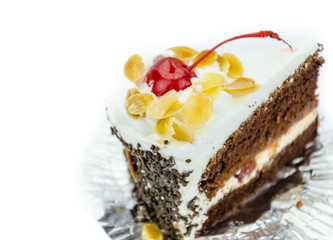 a slice of  cake with cherry topping
