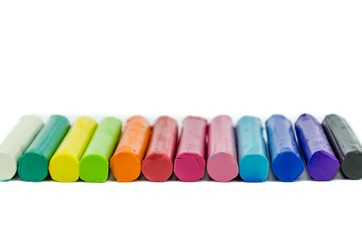 Color plasticine on white background