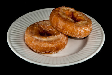 Glazed Donut Isolated on a Black Background