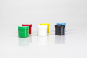 red and green paint boxes with brushes