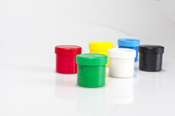 red and green paint boxes with brushes