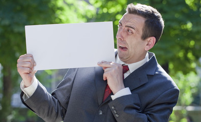 scared business man anxious at message