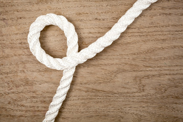 Nylon rope loop on a wooden background