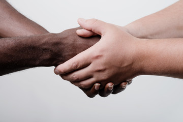 group with mixed race people with hands together