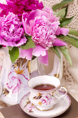 Vintage teacup with spring pi-mesons