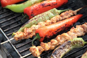 Papier Peint photo Grill / Barbecue Shish kebab with red and green peppers on hot grill.