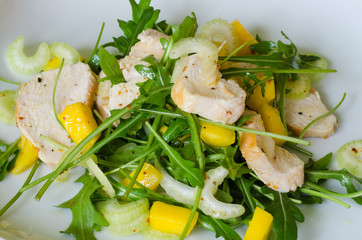 Chicken salad with ruccola and mango