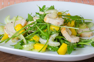 Chicken salad with ruccola and mango