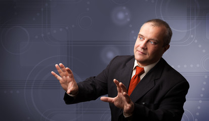 Elegant businessman touching copy space