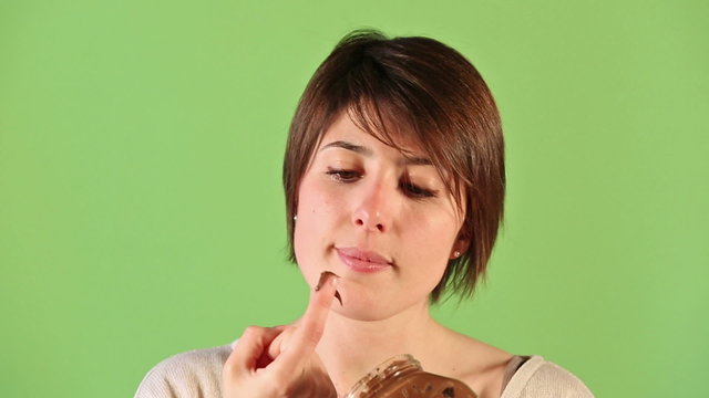 Young Woman Eating Chocolate Cream