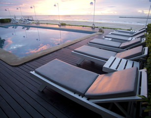 Bed seaside pool near sunset.