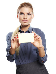 Happy blond woman showing blank credit card.