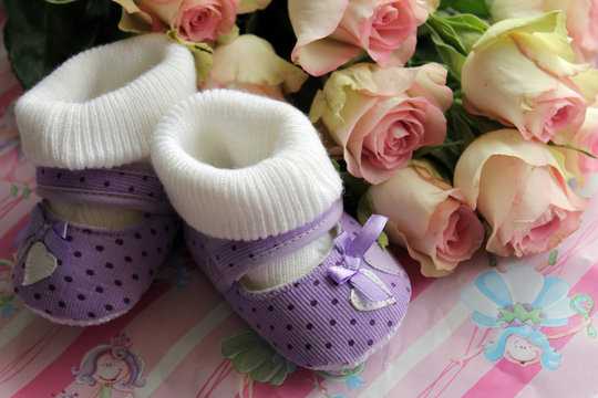 Greetings from newborn birth of his daughter - shoes and flowers
