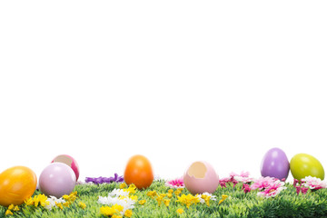 A lot of beautiful Easter eggs on a flowering meadow