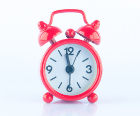 Red clock on white background