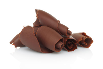 Chocolate shavings on white background.