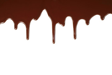 Melting chocolate dripping on white background .