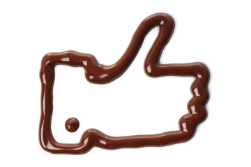 Thumb up hand made of melted chocolate on white background.