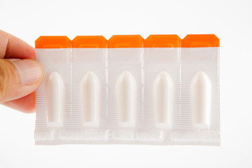 Suppository tablet on white background