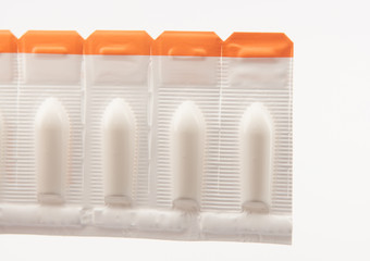 Suppository tablet on white background