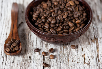 Coffee beans in the wooden plate