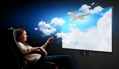 Young woman watching 3d tv