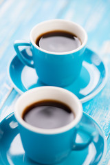 Close-up of two espresso cups, vertical shot