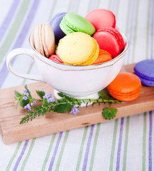 colorful macarons in a small cup