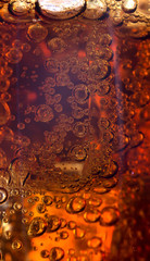 Close up view of the ice cubes in cola