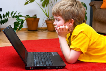 boy with computer at home