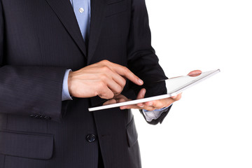 Young businessman's hands working on a tablet pc comuter