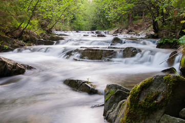 Small waterfall on mountain river