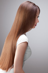 Long Hair. Beautiful Woman with Healthy Brown Hair.