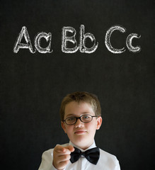 Thinking boy business man with learn English language alphabet