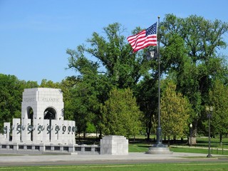 WW II memorial and american and POW flags flying