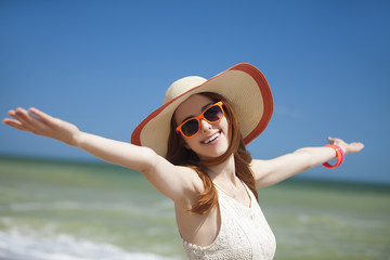 Redhead girl on the beack in spring time