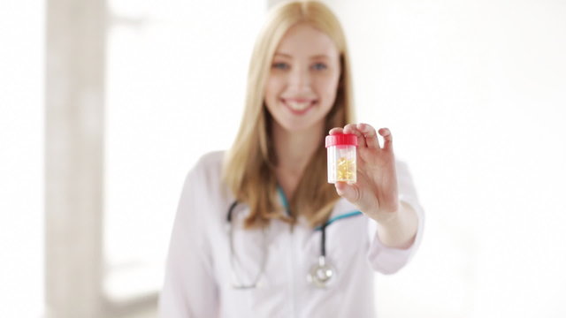 professional doctor showing medication pills