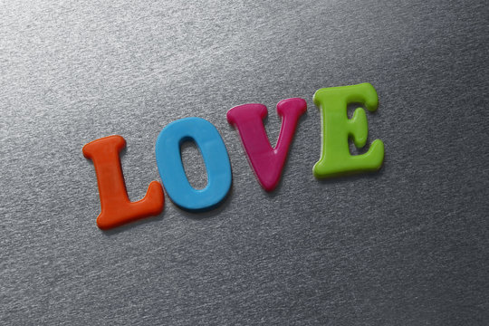 word love spelled out using colored fridge magnets