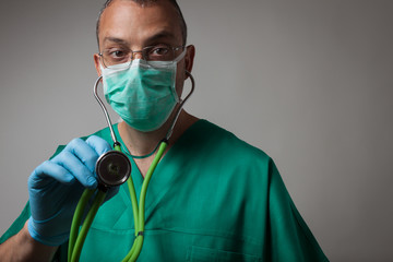 Portrait of a young physician using stethoscope