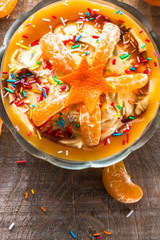 cream dessert orange fruit wooden board