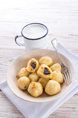 Potato dumplings with plums full
