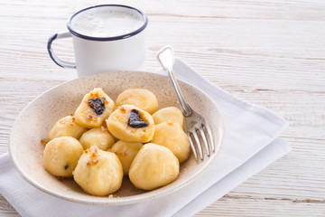 Potato dumplings with plums full