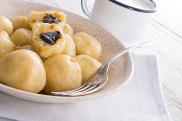 Potato dumplings with plums full