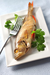 Perch baked in foil with parsley