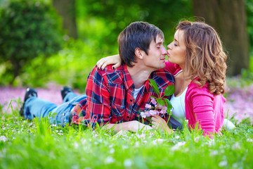 Fototapeta premium young tender couple in spring park
