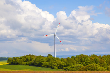 wind turbine generating electricity on blue sky