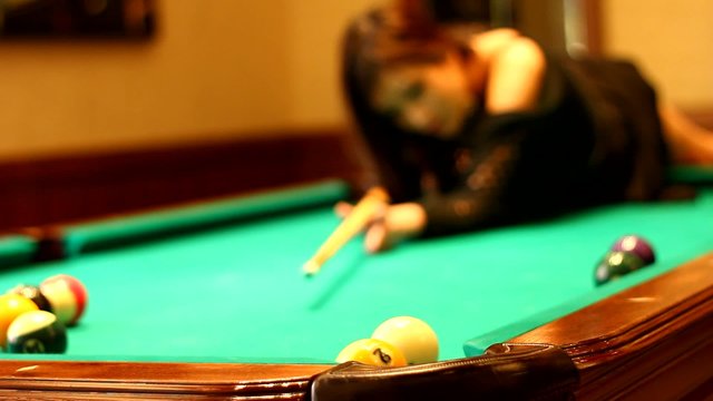girl playing snooker