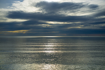 Moody sky over calm Mediterranean sea waters
